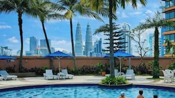 3 outdoor pools, open 7:00 AM to 10:00 PM, pool umbrellas