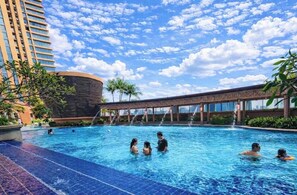 3 outdoor pools, open 7:00 AM to 10:00 PM, pool umbrellas - Luxy Service Suites At Times Square (Kuala Lumpur)