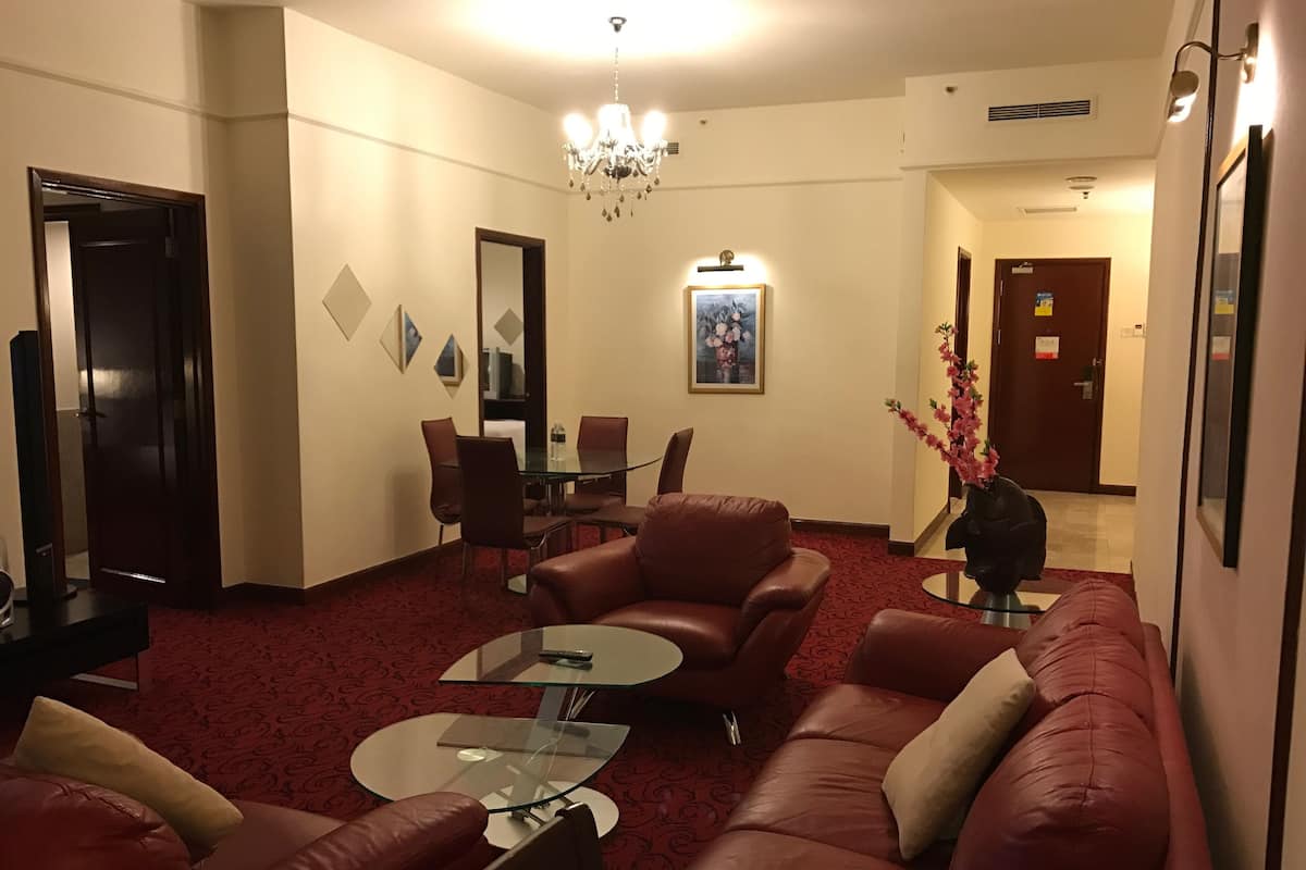 Family Suite, 2 Bedrooms | Living room | 32-inch LED TV with satellite channels, TV, fireplace