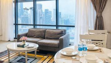 Superior Suite (Premier) | Living area | 32-inch LED TV with satellite channels, TV, fireplace