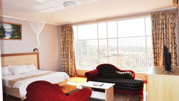 Chambre Exécutive | Literie de qualité supérieure, minibar, coffres-forts dans les chambres