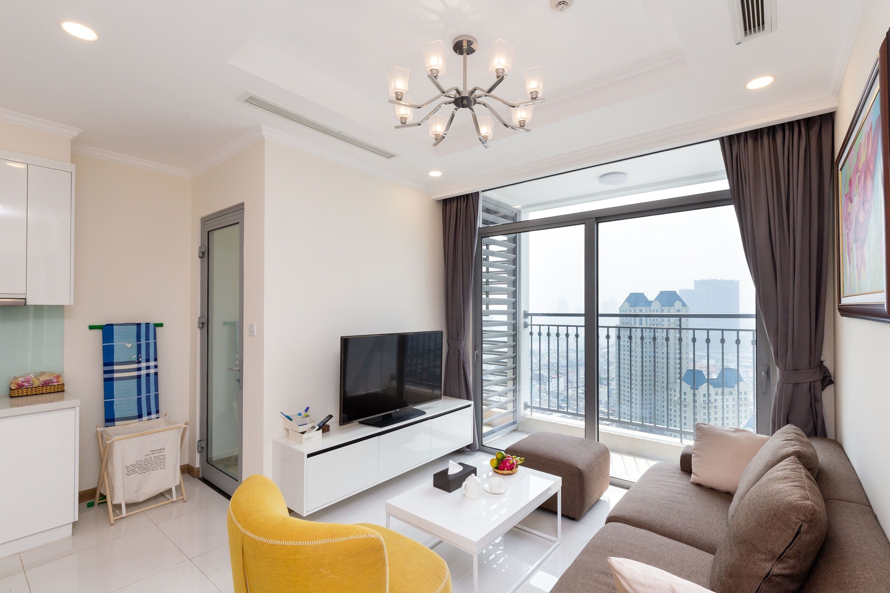two-bedroom apartment with balcony and river view | living area | 45-inch flat-screen tv with cable channels, tv