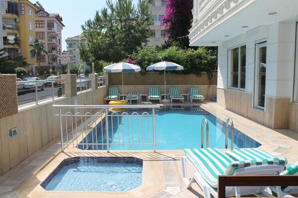 Outdoor pool, pool umbrellas, pool loungers