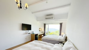 A hotel room with two beds, a TV, a desk, and a window with a view of the outdoors. - Alishan Tea Garden (Fanlu)