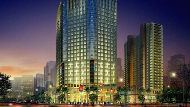 A high-rise hotel with multiple floors, large windows, and a prominent red logo at the top. - ibis Styles Wuhan Optics Valley Square Hotel (Wuhan)