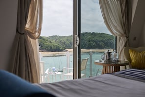 Room, Balcony (Our Best Estuary View) | Free minibar items, in-room safe, desk, laptop workspace