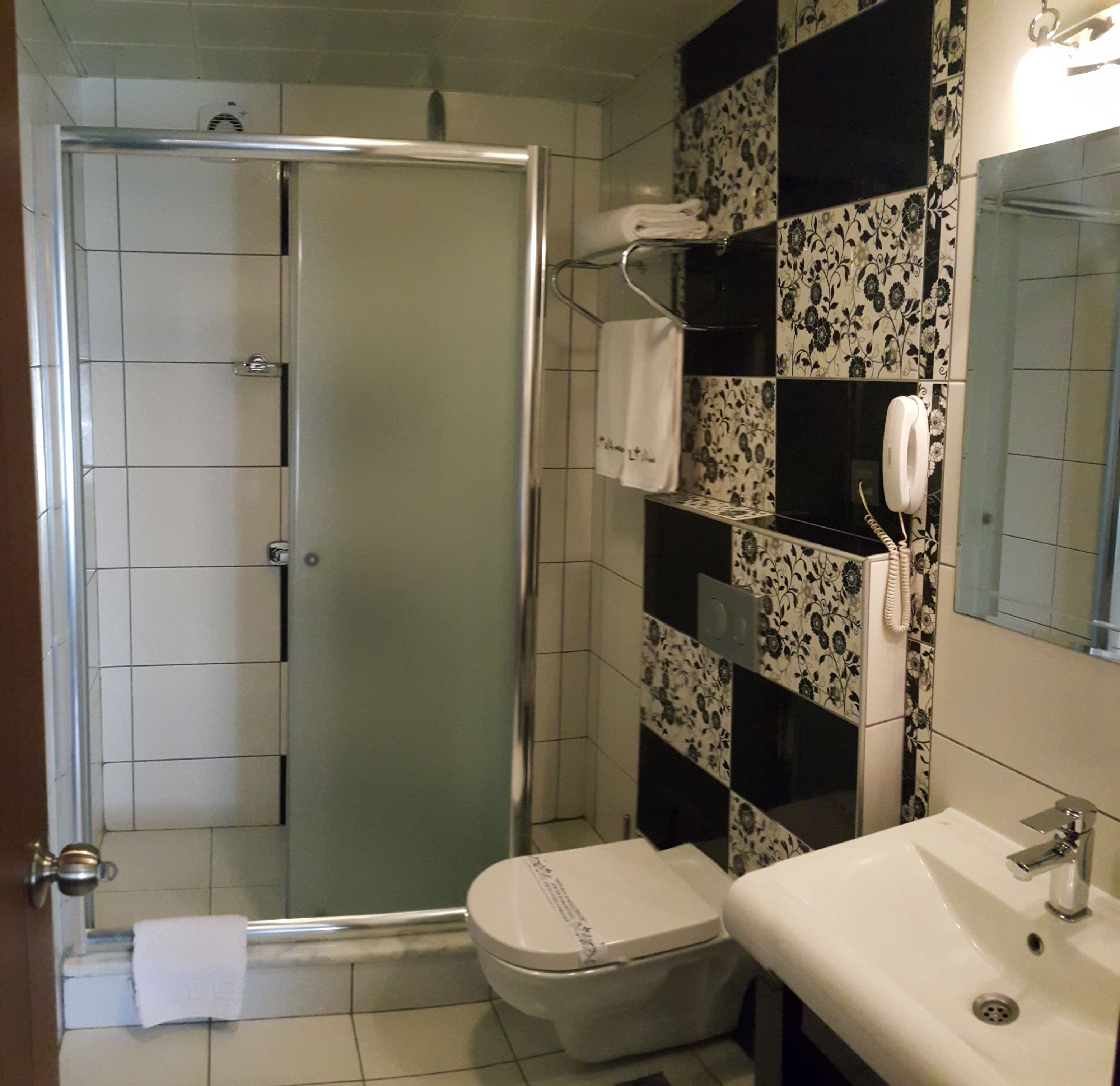standard double room | bathroom | shower, free toiletries, hair dryer, slippers