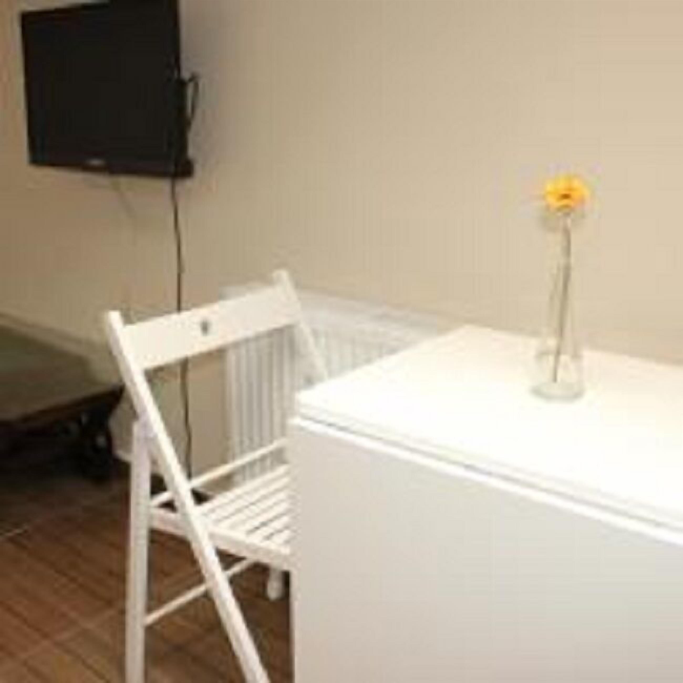 elite triple room, multiple beds, garden view | living area | 28-inch lcd tv with satellite channels, tv