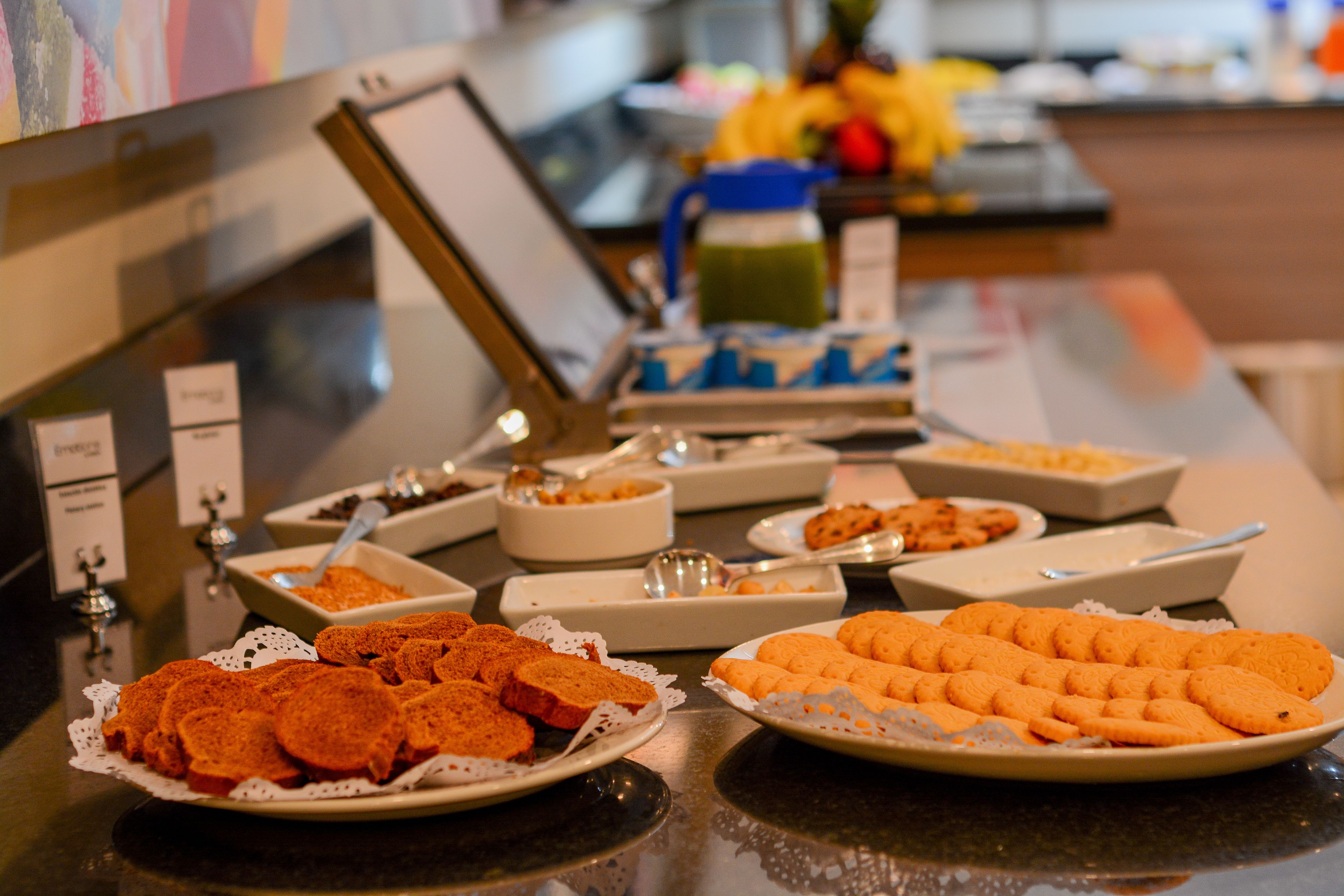A buffet with various food items including cookies and pastries.