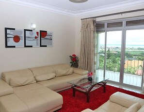 Family Apartment, 2 Bedrooms, Smoking, Courtyard Area | Living room | 40-inch TV with satellite channels