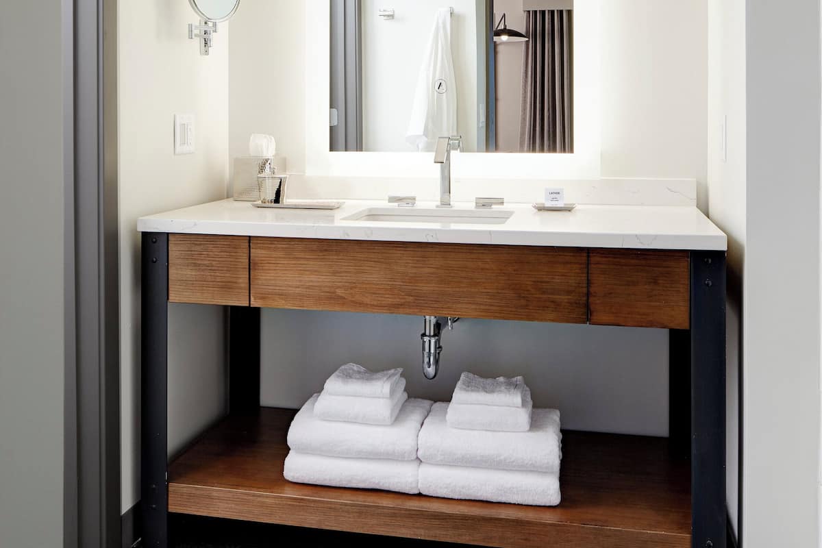 Designer toiletries, hair dryer, bathrobes, slippers