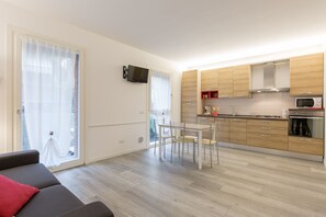 Apartment, 1 Bedroom | Living area | Flat-screen TV