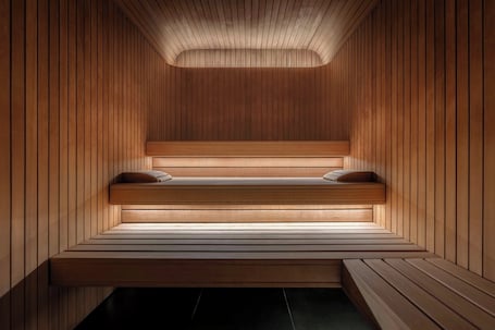 A sauna with wooden walls and benches.