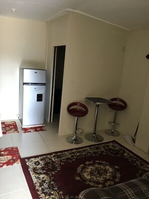 Signature Apartment, 2 Bedrooms, Kitchen, Partial Lake View | Living area | Flat-screen TV