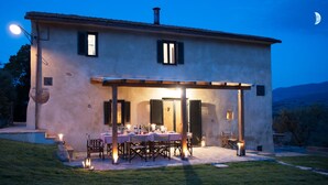 A two-story house with a covered patio area. - Tuscany romance. Rural charm between Montalcino and sea. Relax pur (Cinigiano)