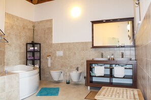 Bathtub, hair dryer, bidet, towels