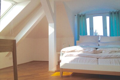Bright modern attic with park view and air conditioning 