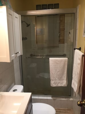 Shower, hair dryer, towels, soap