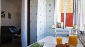 A breakfast table with croissants, orange juice, and a book. - Apartment/ flat - AyamonteResidential flat (Ayamonte)