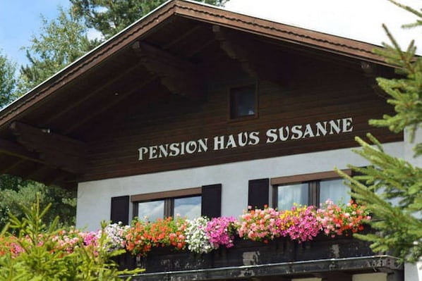 A building with the sign 'Pension Haus Susanne' indicating it is a pension house.