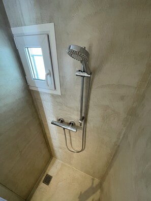 Bathtub, hair dryer, towels, soap