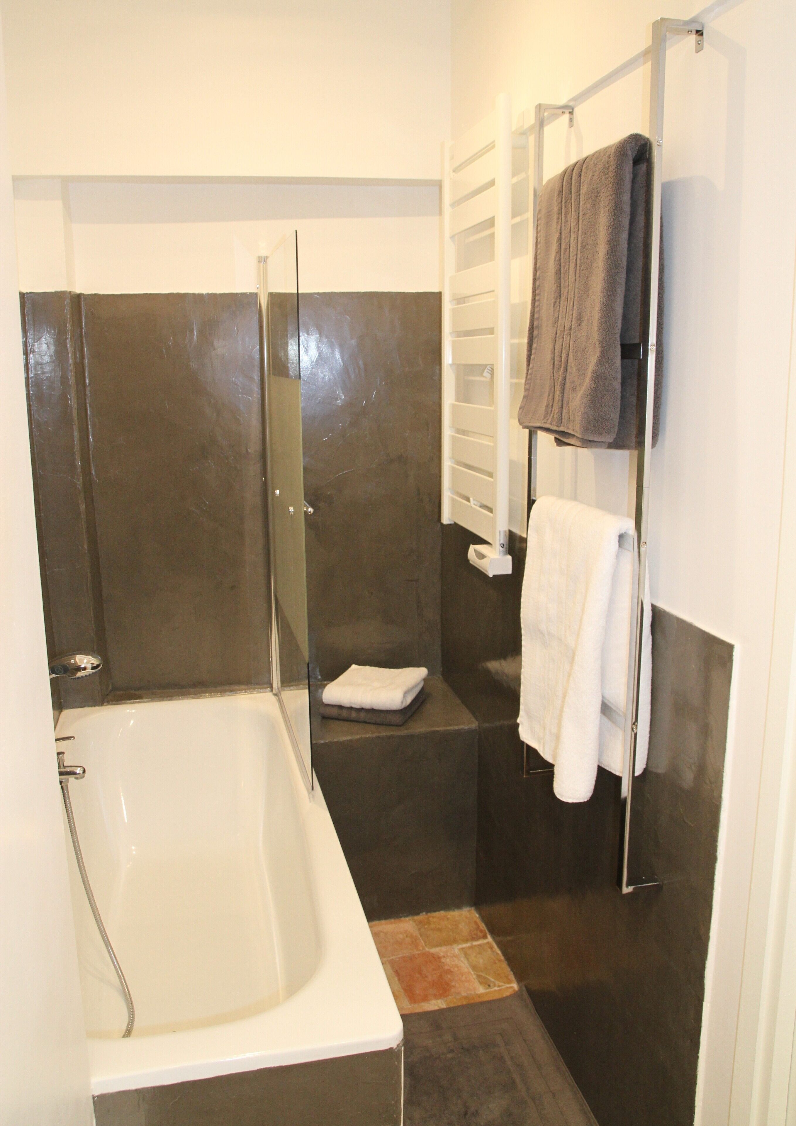 Bathtub, hair dryer, towels, soap