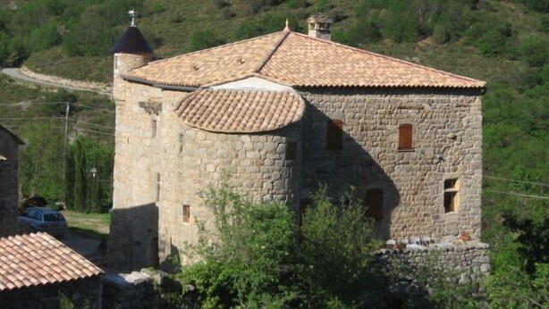 A stone building with a tiled roof, surrounded by greenery and hills. - Longueville Castle, the Thines Malarce valley on Thines (Malarce-Sur-La-Thines)