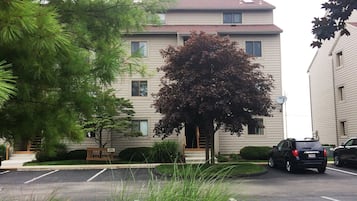 A parking lot with a building in the background.