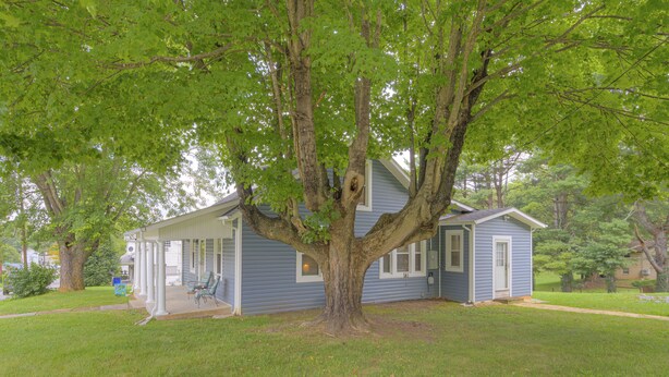 A house with a large tree in front, a porch, and a small shed. -  8 Min. to VT,  15 min. to RU & 4 min. to AQUATIC CENTER  (Christiansburg)