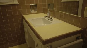 Combined shower/tub, hair dryer, towels, soap