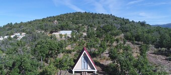 Tiny A-Frame and 6 acres for camping up in the mountains.