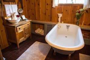 Combined shower/bathtub, hair dryer, towels, toilet paper