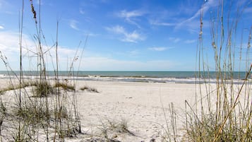 On the beach, sun loungers, beach towels