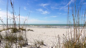 On the beach, sun loungers, beach towels