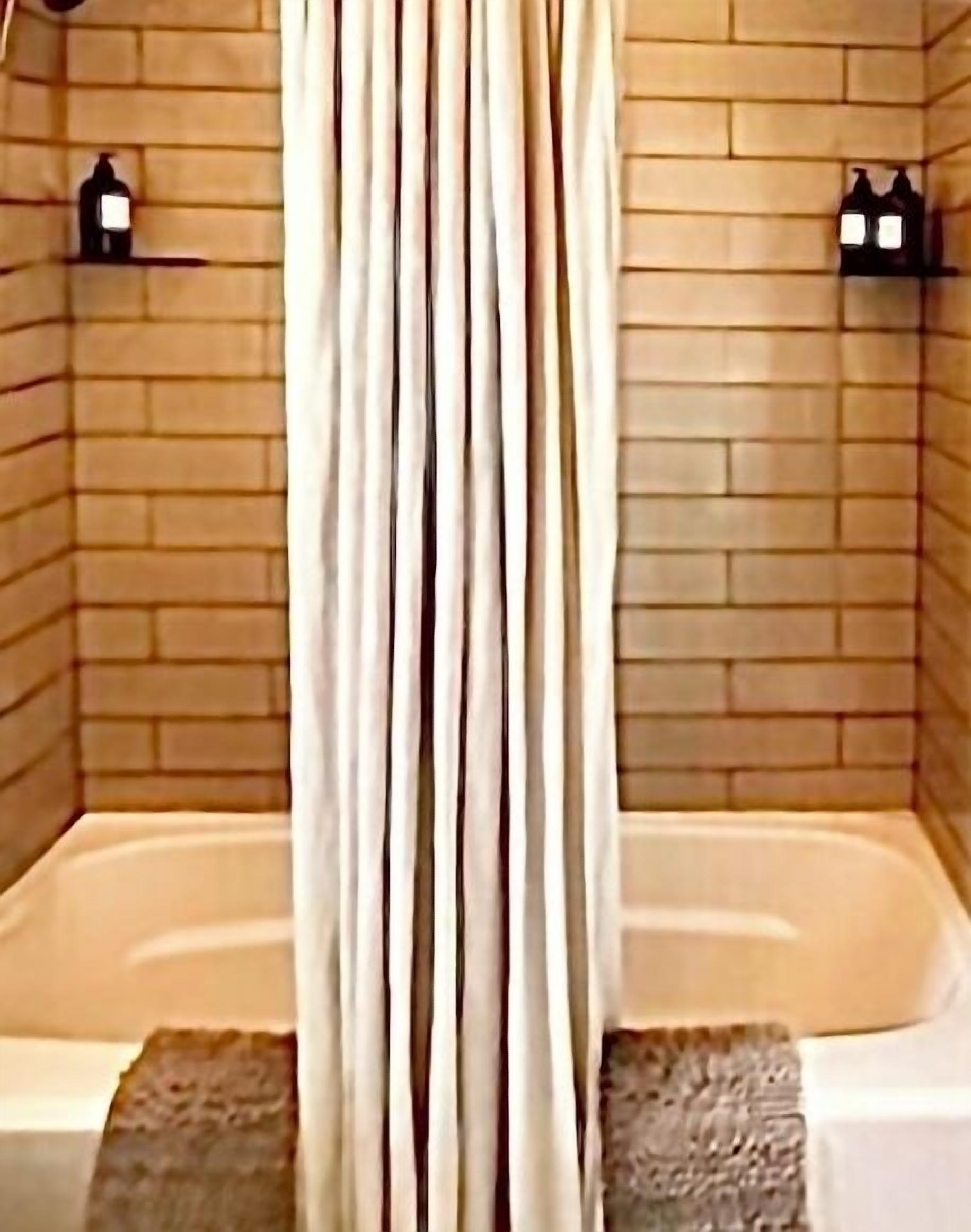 Combined shower/bathtub, hair dryer, towels, soap