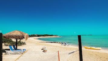 On the beach, sun-loungers, beach towels