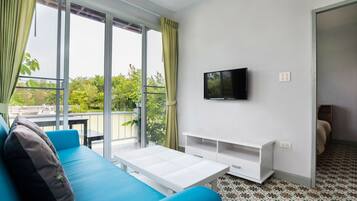 1-Bedroom Bungalow | Living area | 32-inch flat-screen TV with satellite channels, TV