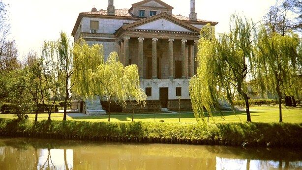 A classical building with columns, surrounded by a pond and trees. - "Like at home" near Venice. (Venezia)