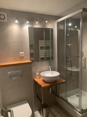 Shower, hair dryer, towels, soap