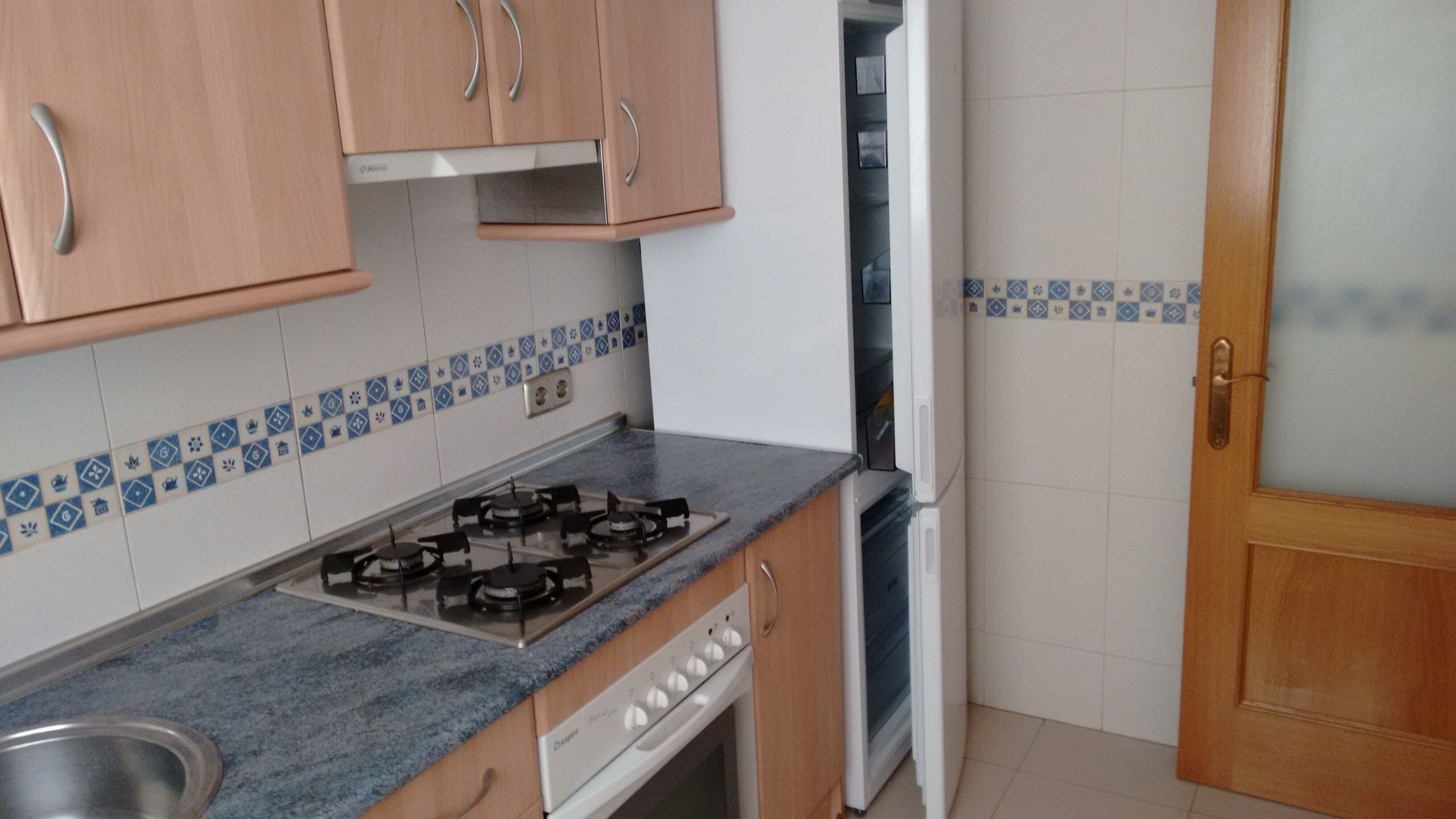 A kitchen with a gas stove, oven, and a dishwasher.