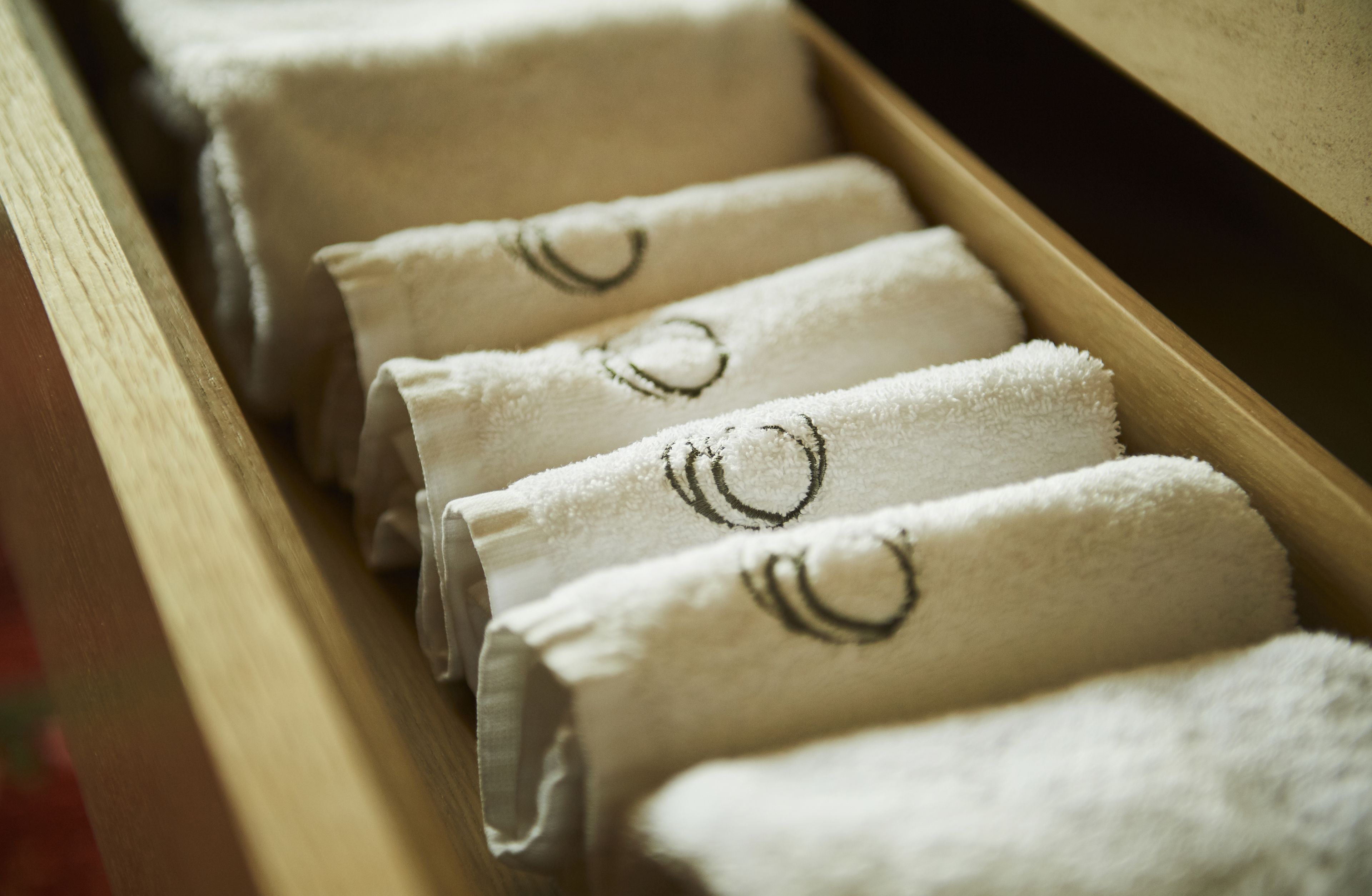 designer toiletries, hair dryer, bathrobes, slippers