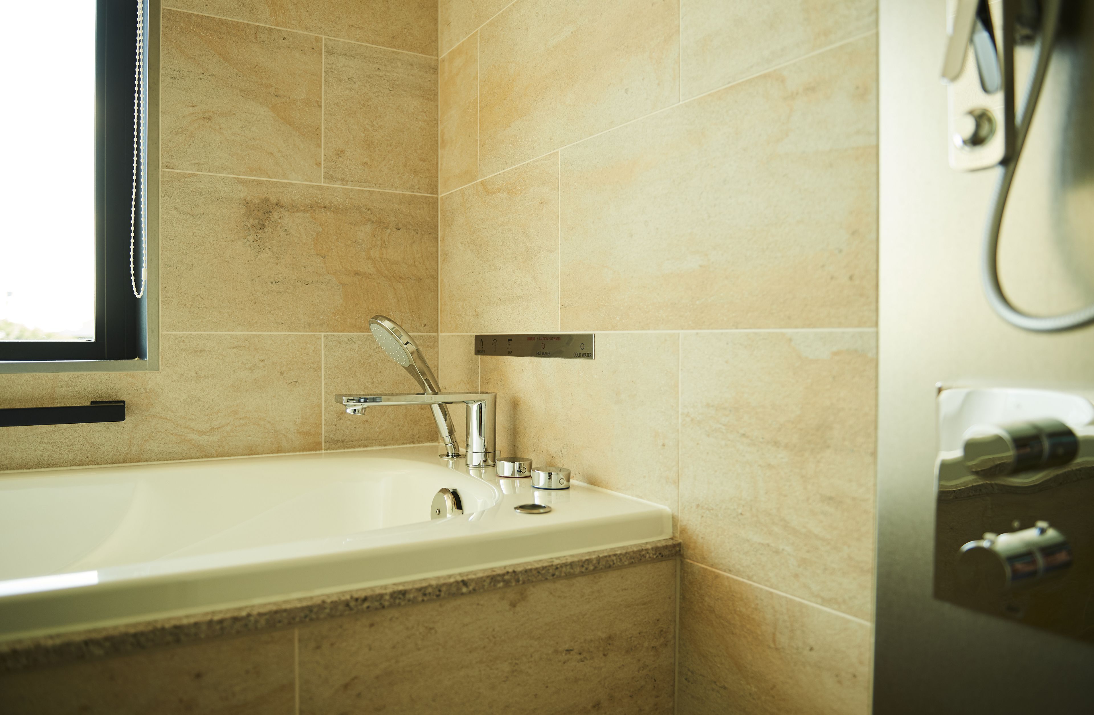 designer toiletries, hair dryer, bathrobes, slippers