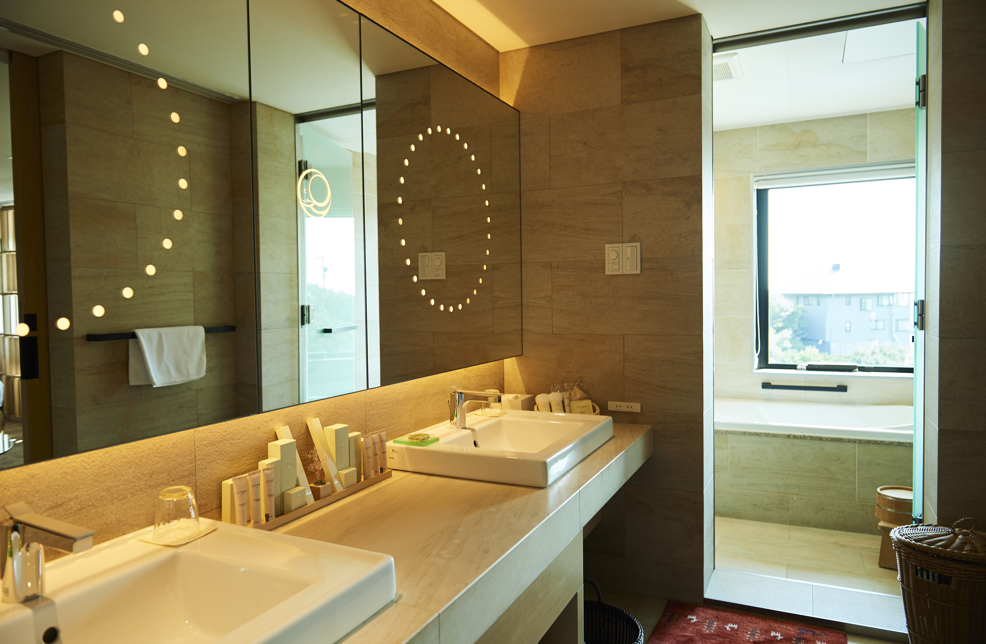 designer toiletries, hair dryer, bathrobes, slippers