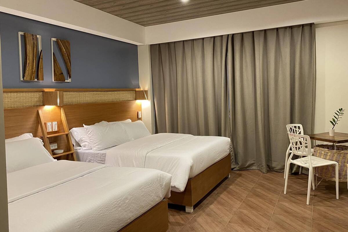 premium room, 2 queen beds, non smoking, private bathroom | 1 bedroom, premium bedding, in-room safe, desk