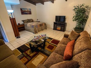 Smart TV, fireplace, books, offices