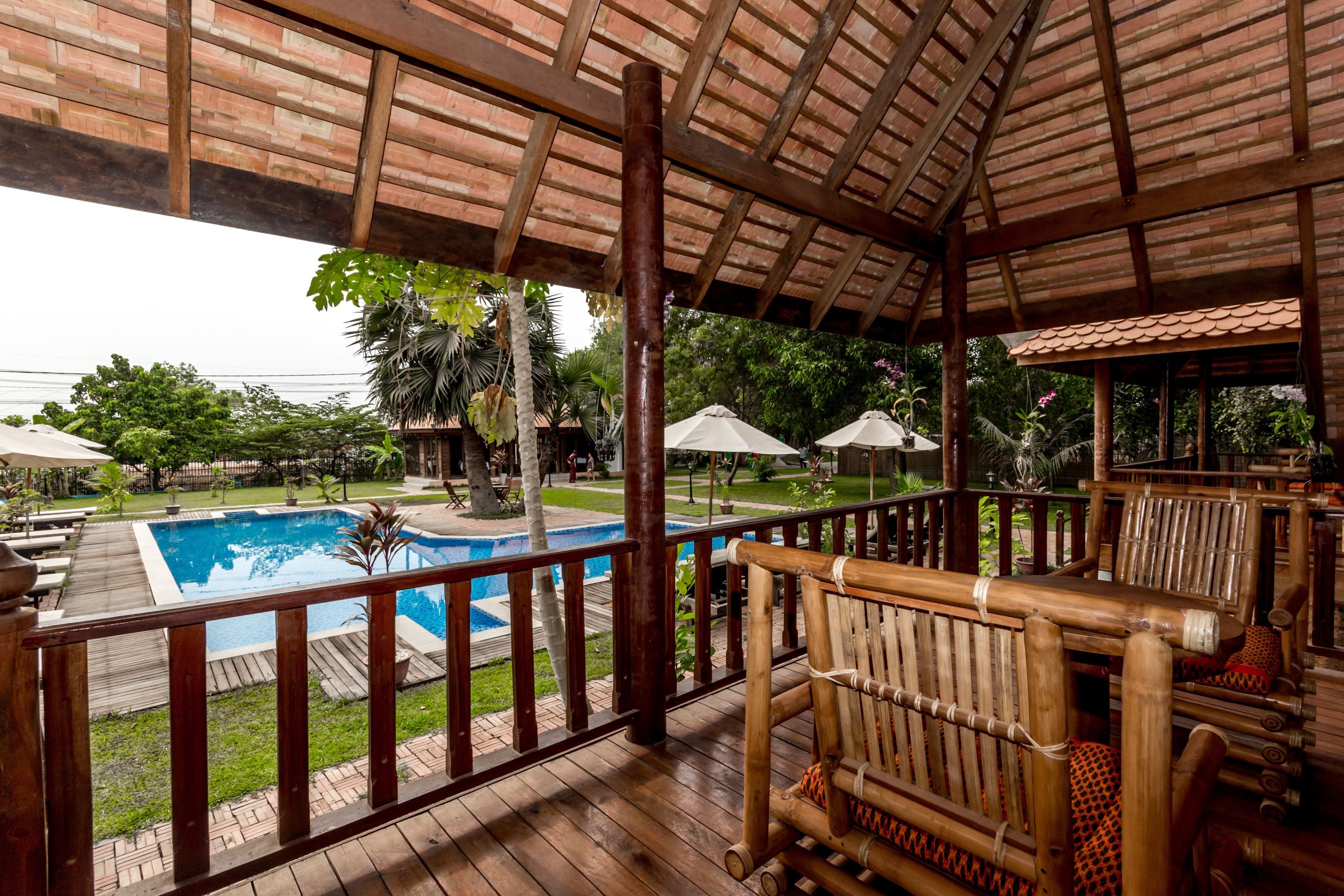 deluxe triple room, multiple beds, balcony, poolside | balcony