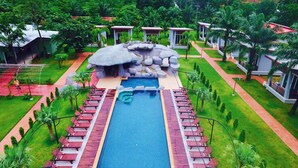A resort with a central swimming pool, lounge chairs, and small bungalows. - Khaolak Mountain View (Takua Pa)