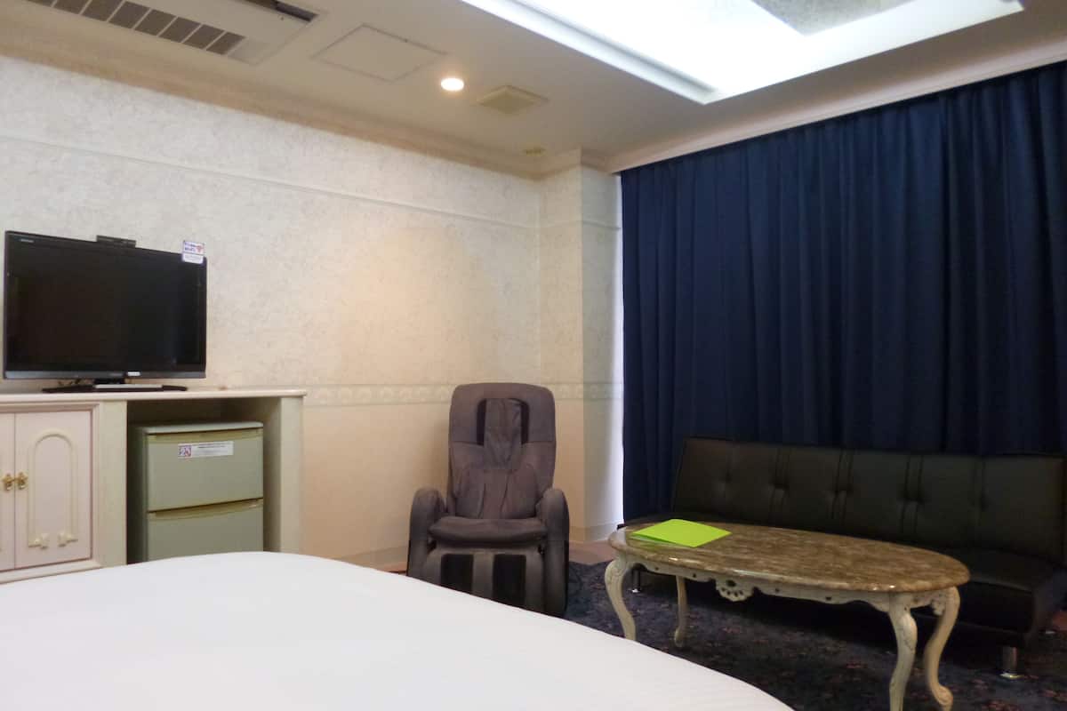 double room with sofa bed & massage chair | 1 bedroom, individually decorated, blackout curtains, free wifi