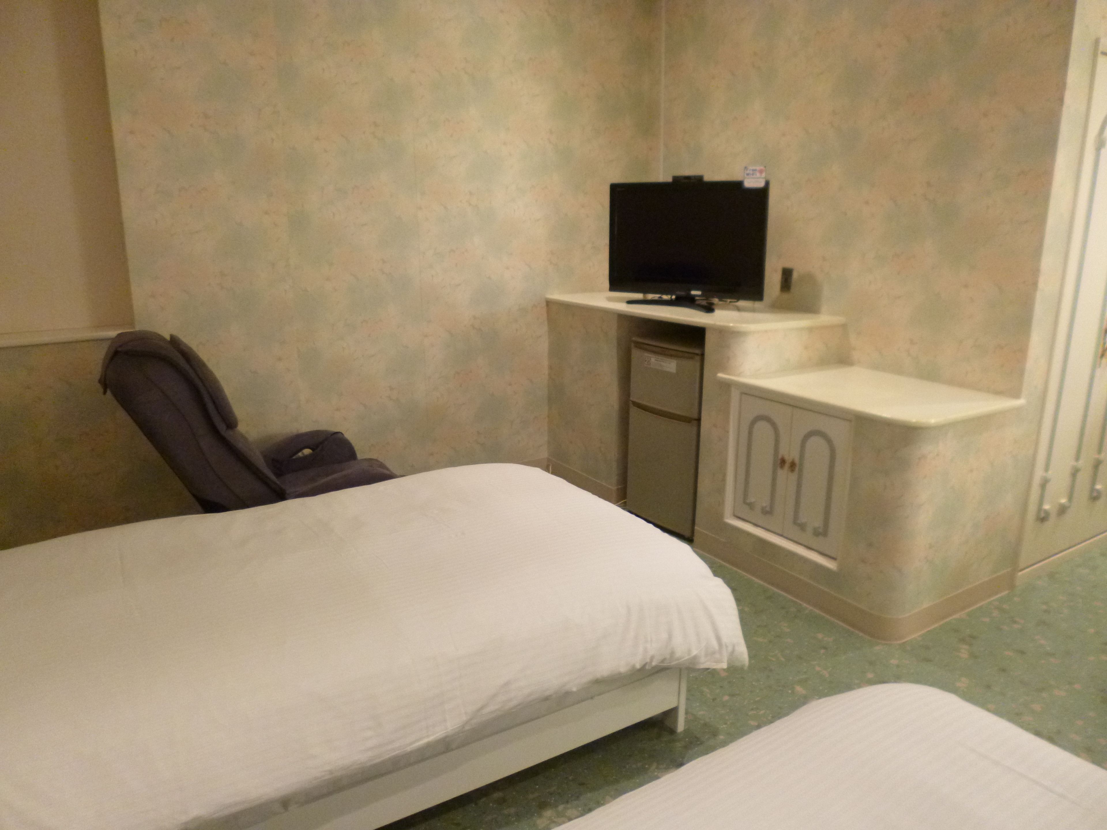twin room with massage chair | 1 bedroom, individually decorated, blackout curtains, free wifi
