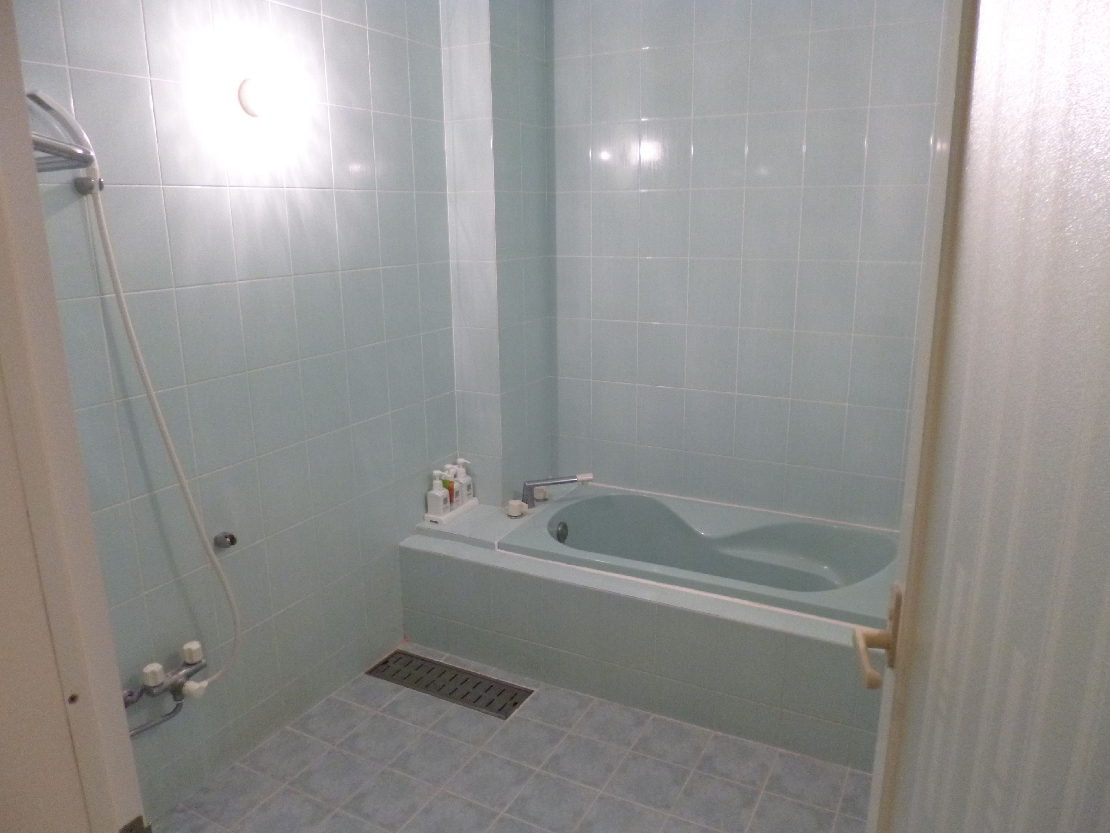 twin room with massage chair | bathroom | separate bathtub and shower, deep-soaking bathtub, free toiletries